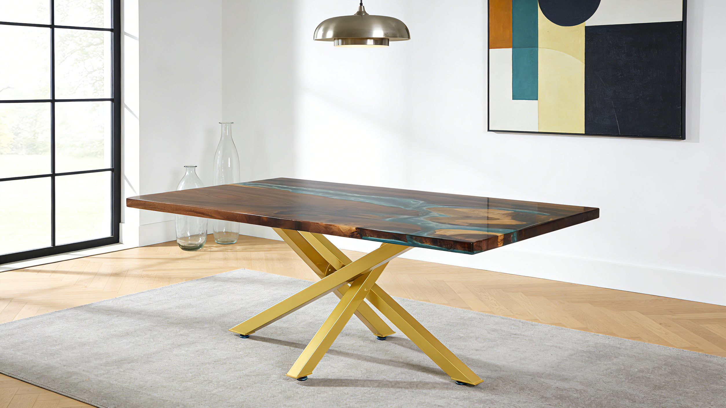 Modern dining table with wooden surface and metal legs in a room with a painting on the wall.