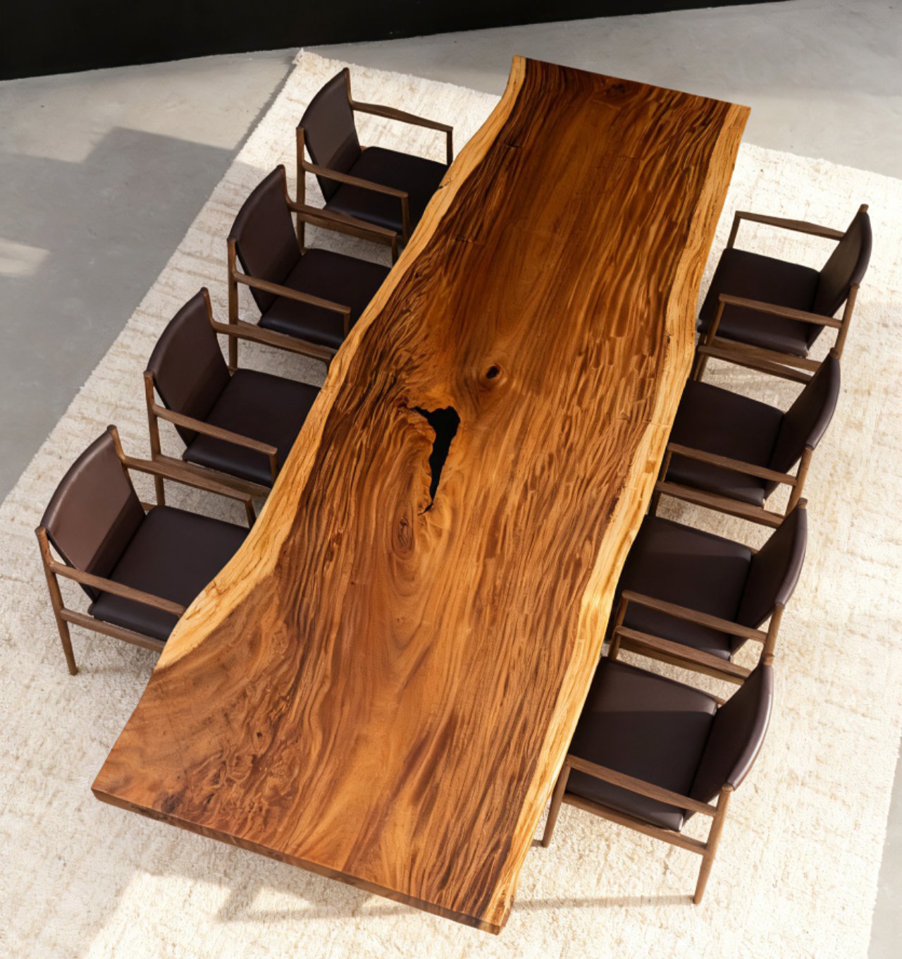 Wooden dining table with chairs on a light-colored floor