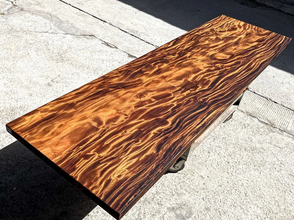 Finished acacia wood slab showing its grain from an angle